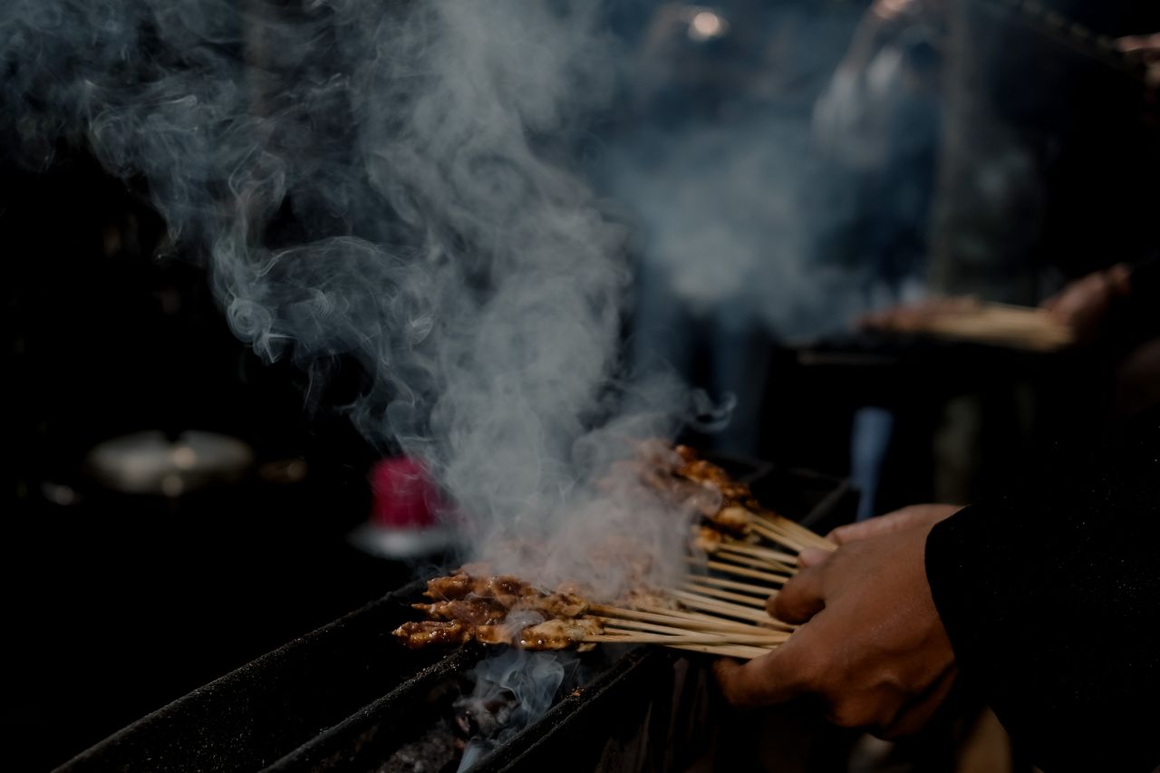 Popular Indonesian street foods including satay, bakso, martabak and es cendol